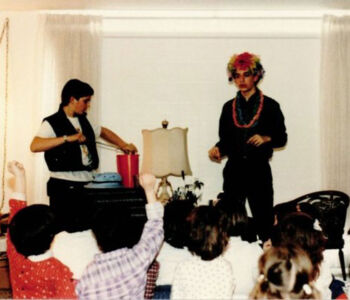 1986 - performing at a birthday party. Gotta love the ridiculous getup! (Credit - Jason Broth)